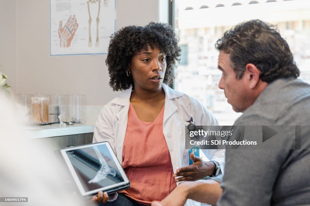 Doctors Help Me Doctor Helps To Answer Questions High-Res Stock Photo - Getty Images