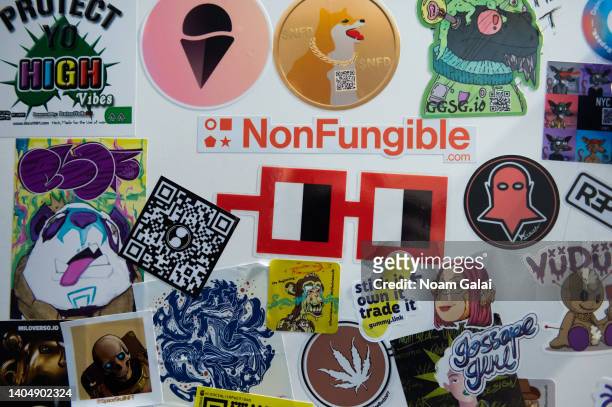 Stickers of NFT projects are seen inside Marriott Marquis during the 4th annual NFT.NYC conference on June 23, 2022 in New York City. The four-day...