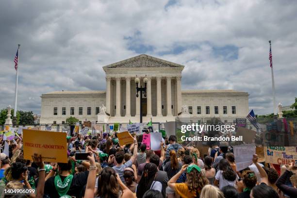 People protest in response to the Dobbs v Jackson Women's Health Organization ruling in front of the U.S. Supreme Court on June 24, 2022 in...