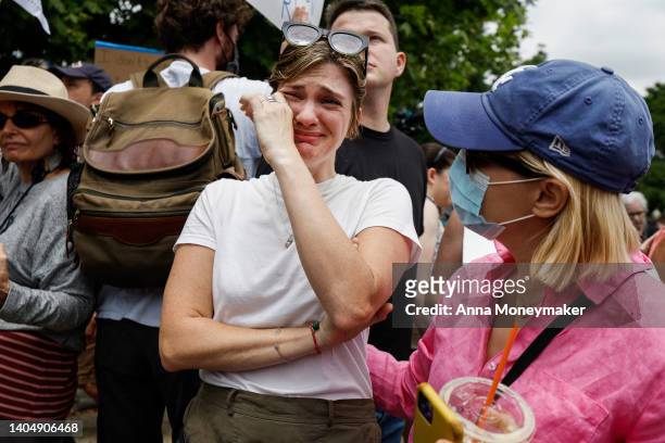 Abortion-rights activist Ali Stigall is comforted as she reacts to the announcement to the Dobbs v Jackson Women's Health Organization ruling in...
