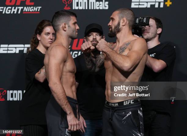 Opponents Thiago Moises of Brazil and Christos Giagos face off during the UFC Fight Night weigh-in at UFC APEX on June 24, 2022 in Las Vegas, Nevada.