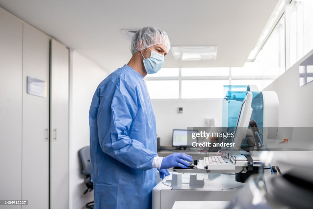 Technician working at the laboratory analyzing blood samples