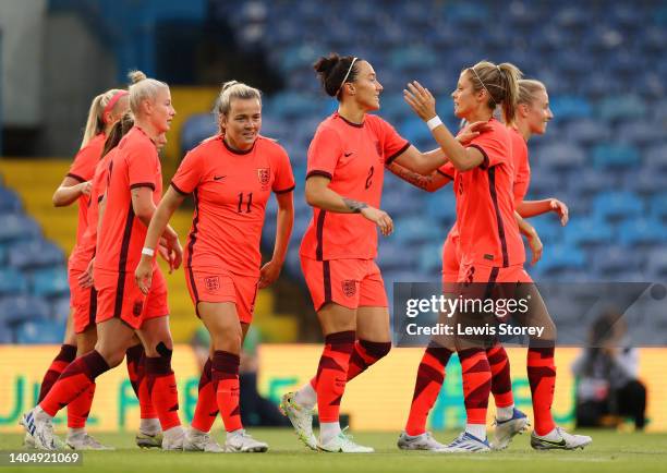 Lucy Bronze of England celebrates scoring their side's first goal with teammates during the Women's International friendly match between England and...
