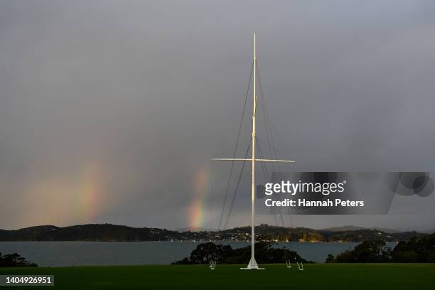 Two rainbows are seen behind the flag pole at the Waitangi Treaty grounds on June 23, 2022 in Waitangi, New Zealand.