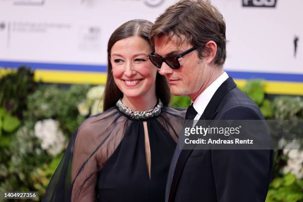 Alexandra Maria Lara and Sam Riley arrive for the 72nd Lola - German Film Award at Palais am Funkturm on June 24, 2022 in Berlin, Germany.