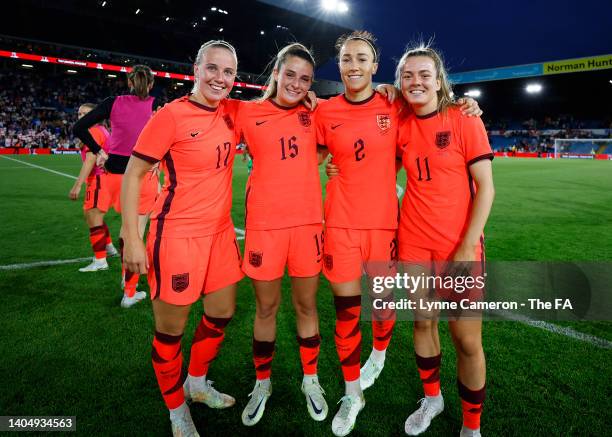 Beth Mead, Ella Toone, Lucy Bronze and Lauren Hemp of England pose for a photograph after the final whistle of the Women's International friendly...
