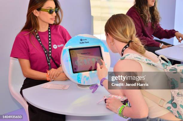 Creators, fans and attendees have their “Audio Tarot Cards” read at an immersive Spotify booth during VidCon 2022 at Anaheim Convention Center on...