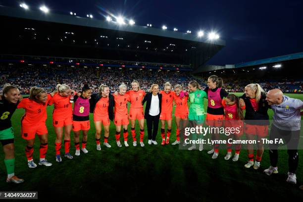 Sarina Wiegman, Manager of England, speaks to the England team as they huddle after the final whistle of the Women's International friendly match...