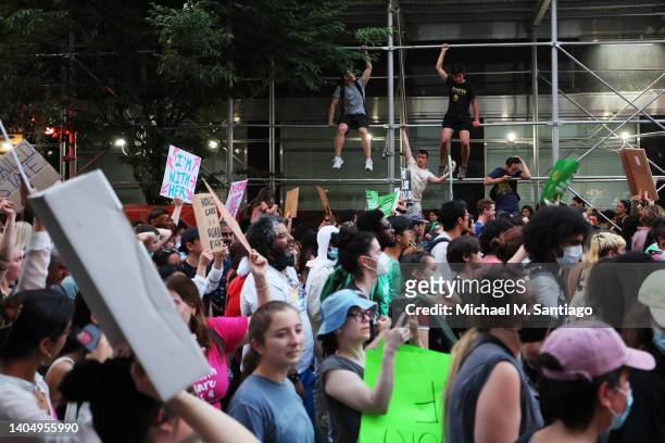 People march as they protest the Supreme Courts 6-3 decision in the Dobbs v. Jackson Women’s Health Organization on June 24, 2022 in New York City....