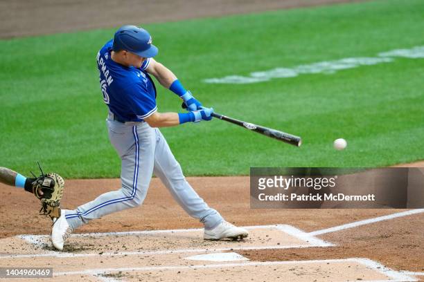 Matt Chapman of the Toronto Blue Jays hits a three-run RBI double in the second inning against the Milwaukee Brewers at American Family Field on June...