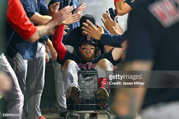 Christian Arroyo of the Boston Red Sox celebrates with teammates after hitting a two-run homer during the seventh inning at Progressive Field on June...
