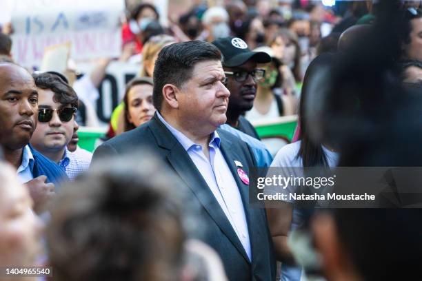 Governor J. B. Pritzker of Illinois marches with protesters during an abortion rights march on June 24, 2022 in Chicago, Illinois. Crowds gathered to...