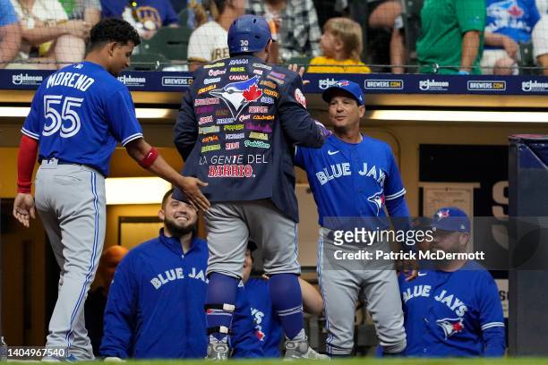 Alejandro Kirk of the Toronto Blue Jays celebrates with the Blue Jacket after hitting a two-run home run against the Milwaukee Brewers in the seventh...