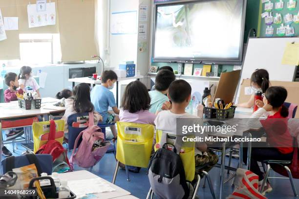 Students attend class on the second to last day of school as New York City public schools prepare to wrap up the year at Yung Wing School P.S. 124 on...
