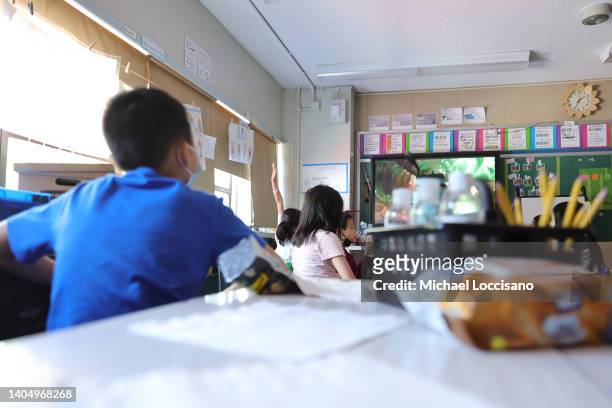Students attend class on the second to last day of school as New York City public schools prepare to wrap up the year at Yung Wing School P.S. 124 on...