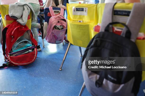 Student backpacks hang on the backs of classroom chairs on the second to last day of school as New York City public schools prepare to wrap up the...