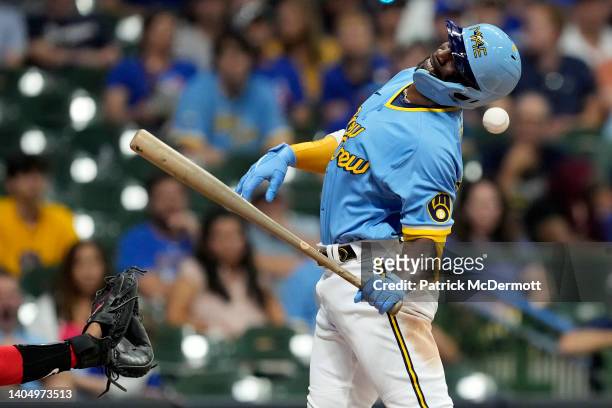 Andrew McCutchen of the Milwaukee Brewers is hit by a pitch in the eighth inning against the Toronto Blue Jays at American Family Field on June 24,...