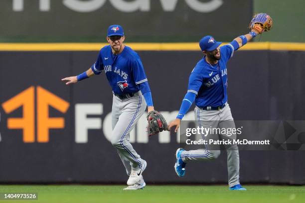 Bradley Zimmer and Lourdes Gurriel Jr. #13 of the Toronto Blue Jays celebrate after defeating the Milwaukee Brewers 9-4 at American Family Field on...