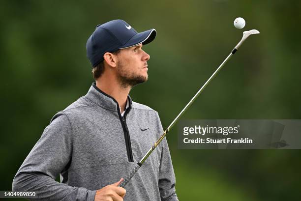 Thomas Pieters of Belgium watches his golf ball as it falls on his wedge during Day Two of the BMW International Open at Golfclub Munchen Eichenried...