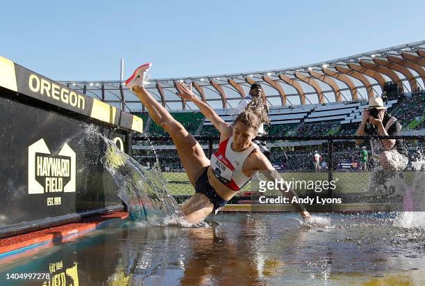 Caroline Austin falls in the water during the semi final of the Women 3,000 Meter Steeplechase during the 2022 USATF Outdoor Championships at Hayward...