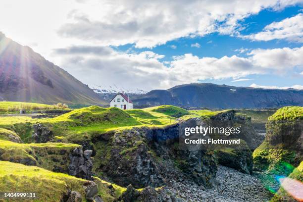 arnarstapi has several old and charming houses with interesting stories to them and is renowned for its beautiful nature - snaefellsnes imagens e fotografias de stock