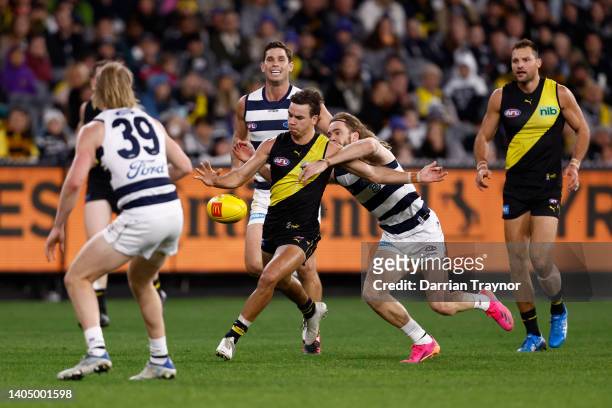 Daniel Rioli of the Tigers kicks the ball during the round 15 AFL match between the Geelong Cats and the Richmond Tigers at Melbourne Cricket Ground...