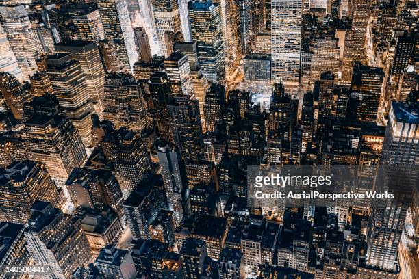 aerial view of manhattan at night / nyc - cityscape aerial stock pictures, royalty-free photos & images