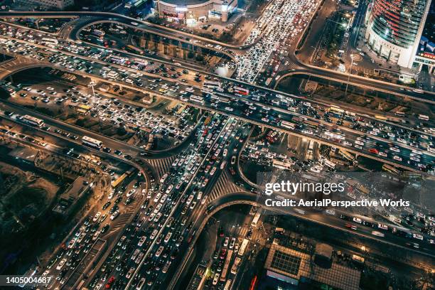 drone point view of busy traffic at night - busy street stock pictures, royalty-free photos & images