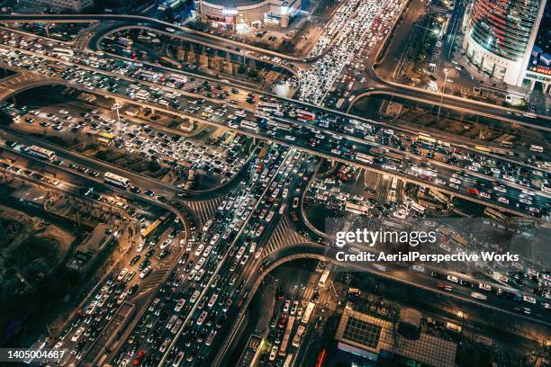 drone point view of busy traffic at night - bottleneck stock pictures, royalty-free photos & images