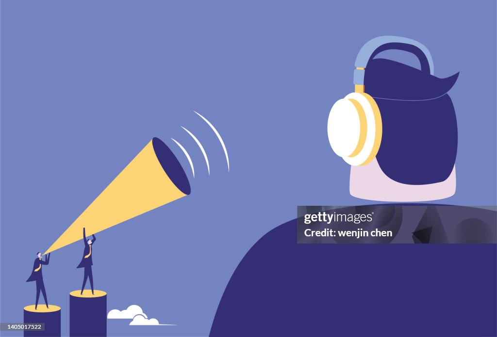 Two business men raise the megaphone to communicate with the giant