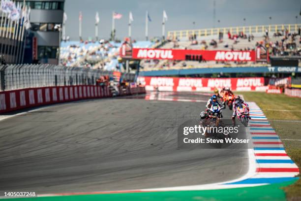 Miguel Oliveira of Portugal and Red Bull KTM Factory Racing rides in front of Fabio Di Giannantonio of Italy and Gresini Racing MotoGP, Alex Marquez...