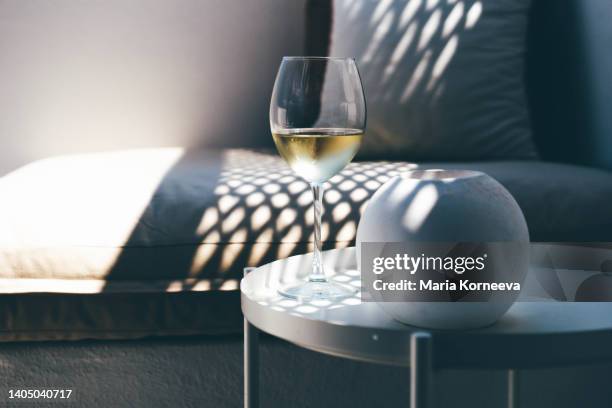 summer terrace with sea view. glasses of wine on a balcony. - esclusivo foto e immagini stock