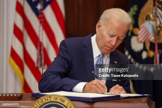 President Joe Biden signs the Bipartisan Safer Communities Act into law in the Roosevelt Room of the White House on June 25, 2022 in Washington, DC....