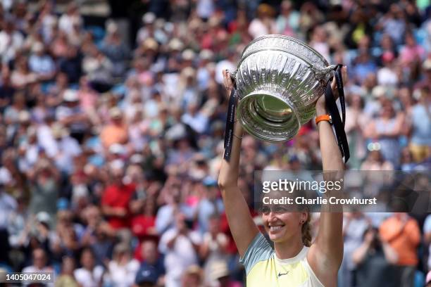 Petra Kvitova of Czech Republic celebrates with the trophy after winning the women's singles final against Jelena Ostapenko of Latvia on day eight of...