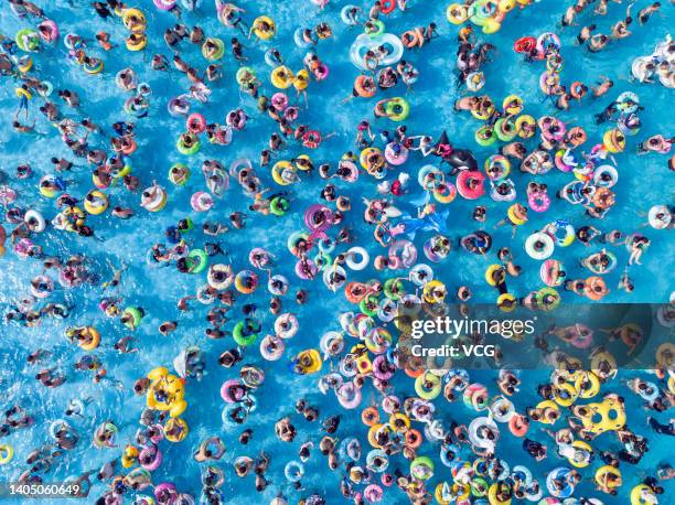 Aerial view of people enjoying themselves at a swimming pool to beat the heat on June 25, 2022 in Nanjing, Jiangsu Province of China.