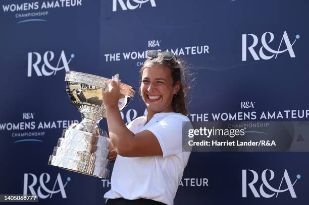 Jessica Baker of Gosforth Park Ladies celebrates with the Women's Amateur Championship Trophy following her victory in the final between Louise...