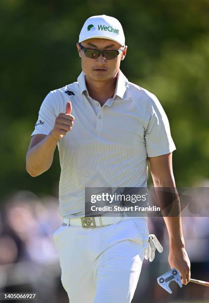 Haotong Li of China gives the thumbs up on the 18th hole during Day Three of the BMW International Open at Golfclub Munchen Eichenried on June 25,...