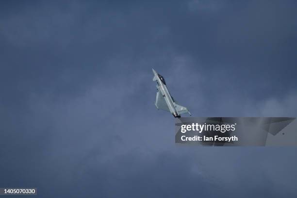 An RAF Typhoon flies over Scarborough castle as it performs during the Armed Forces Day National Event at Scarborough on June 25, 2022 in...