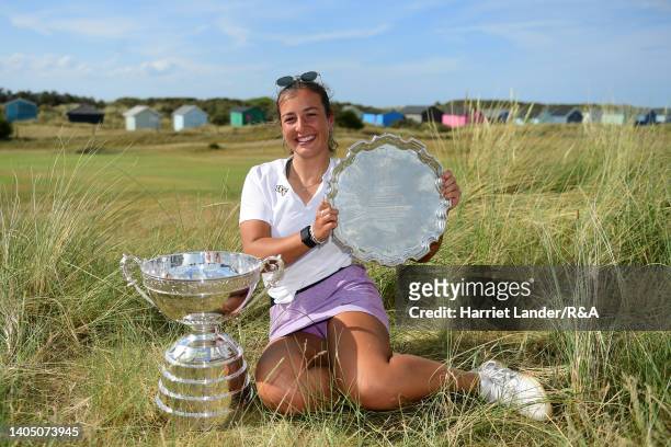 Jessica Baker of Gosforth Park Ladies celebrates with the Women's Amateur Championship Cup Trophy and the Pam Barton Memorial Salver following her...