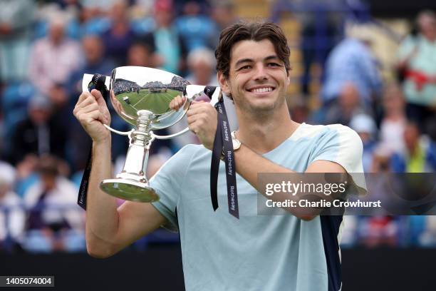 Taylor Fritz of USA celebrates with the trophy after winning the men's singles final against Maxime Cressy of USA on day eight of the Rothesay...