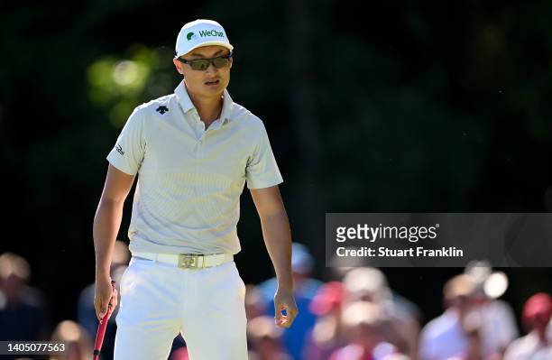 Haotong Li of China ponders during Day Three of the BMW International Open at Golfclub Munchen Eichenried on June 25, 2022 in Munich, Germany.