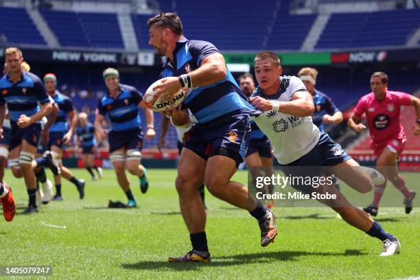 Dylan Fawsitt of Rugby New York carries the ball past Juan-Philip Smith of the Seattle Seawolves in the first half during the Major League Rugby...