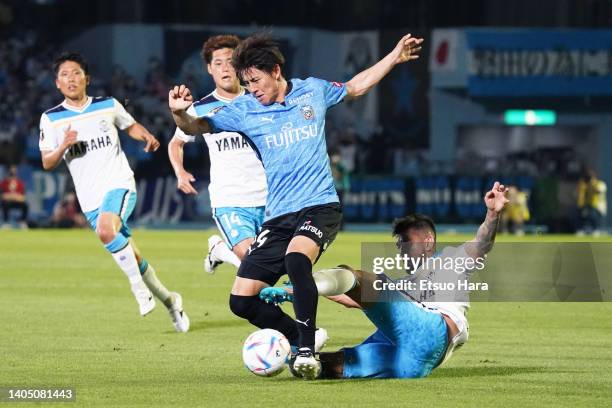 Yasuto Wakizaka of Kawasaki Frontale is tackled by Ricardo Graca of Jubilo Iwata during the J.LEAGUE Meiji Yasuda J1 18th Sec. Match between Kawasaki...