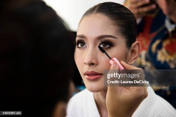 Yushin, representing Japan, prepares backstage before competing in Miss International Queen on June 25, 2022 in Pattaya, Thailand. Thailand hosts...