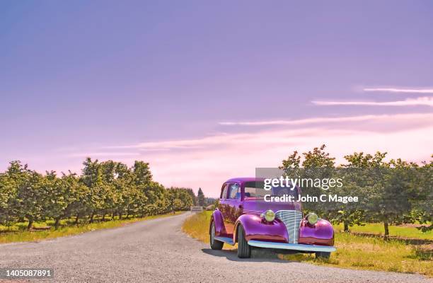 vintage car and orchard - 1930 1939 stockfoto's en -beelden