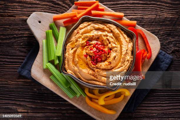 roasted red pepper hummus - roasted pepper stock pictures, royalty-free photos & images