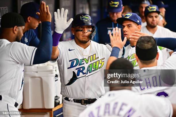 Isaac Paredes of the Tampa Bay Rays celebrates with teammates after hitting a home run in the eighth inning against the Pittsburgh Pirates at...