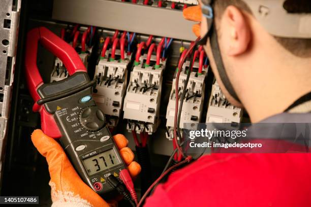 electrician working on electric panel - instrument of measurement stock pictures, royalty-free photos & images