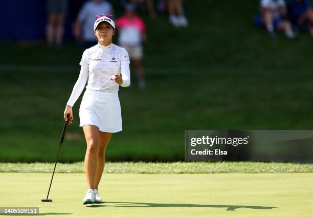 Lydia Ko of New Zealand waves on the 18th green during the third round of the KPMG Women's PGA Championship at Congressional Country Club on June 25,...