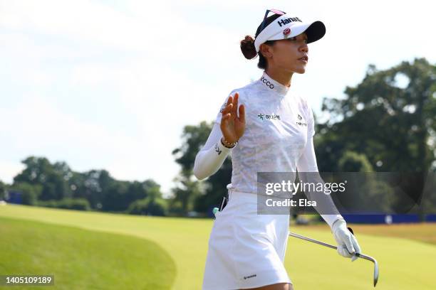 Lydia Ko of New Zealand waves after chipping to the 18th green during the third round of the KPMG Women's PGA Championship at Congressional Country...